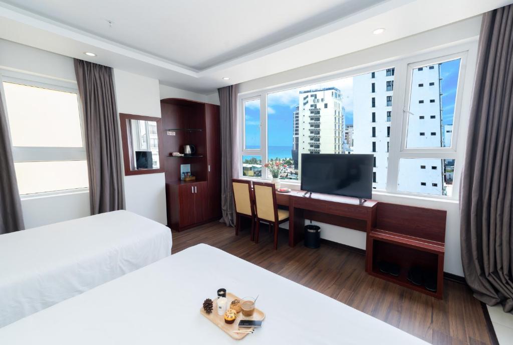 TV a/nebo společenská místnost v ubytování Dao Ngoc Hotel Da Nang