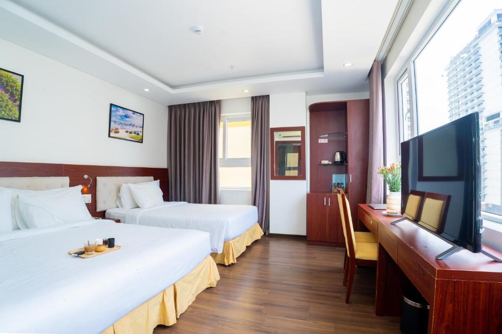 TV a/nebo společenská místnost v ubytování Dao Ngoc Hotel Da Nang