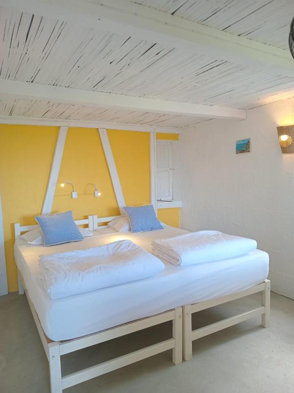 Postel nebo postele na pokoji v ubytování Fantaisie Lodges