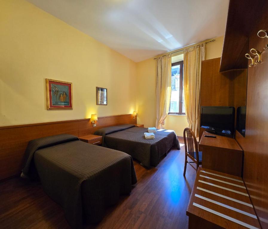 Postel nebo postele na pokoji v ubytování Hotel Azzurra