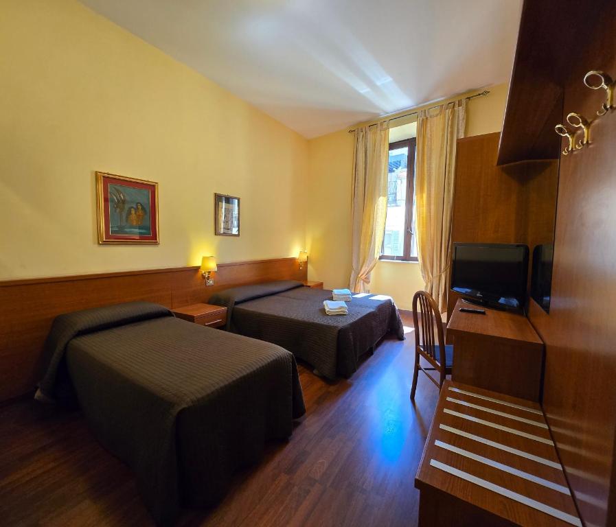 Postel nebo postele na pokoji v ubytování Hotel Azzurra