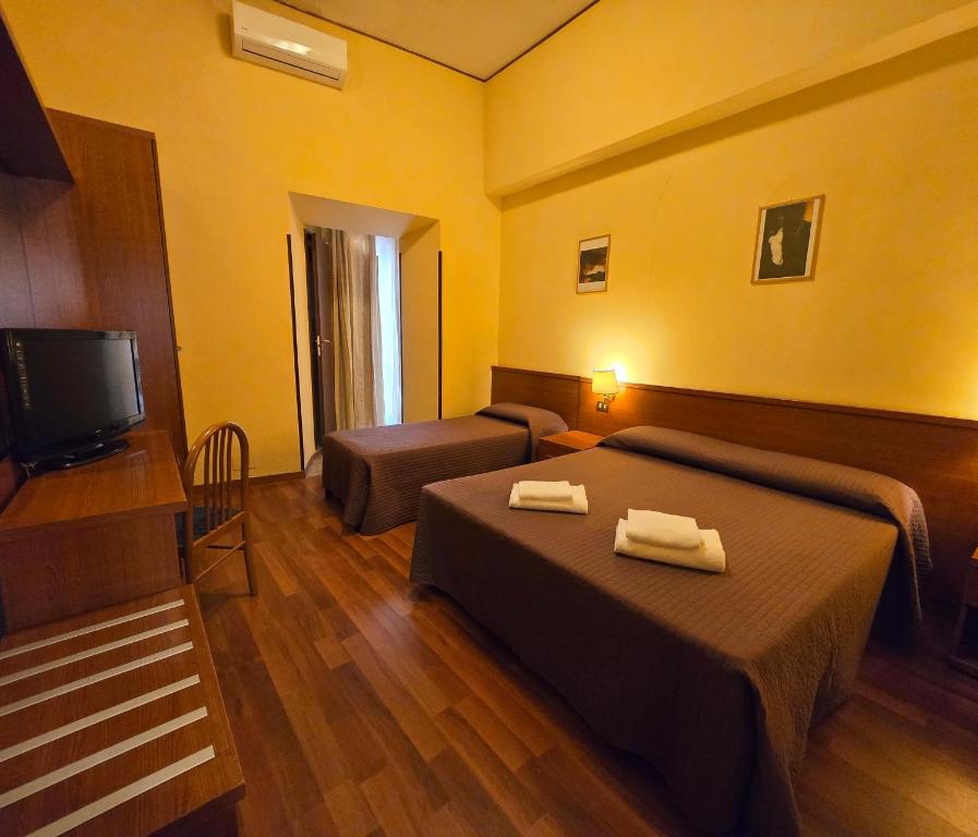 Postel nebo postele na pokoji v ubytování Hotel Azzurra