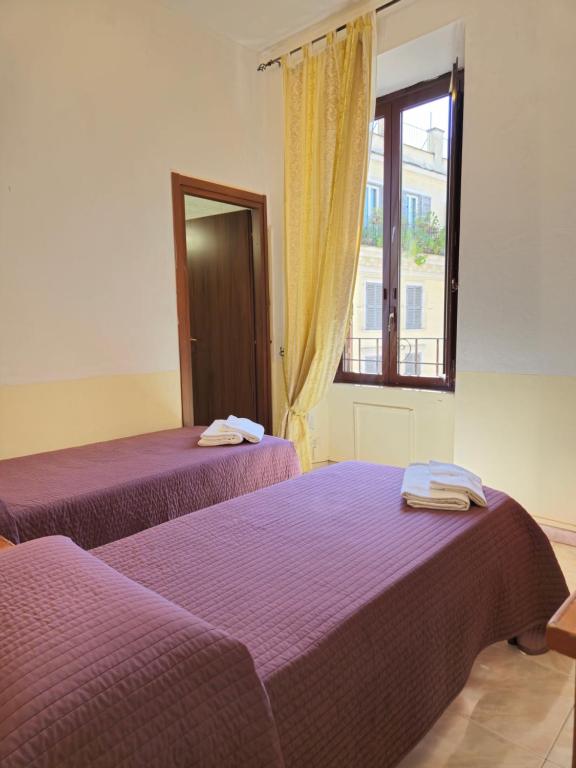Postel nebo postele na pokoji v ubytování Hotel Azzurra