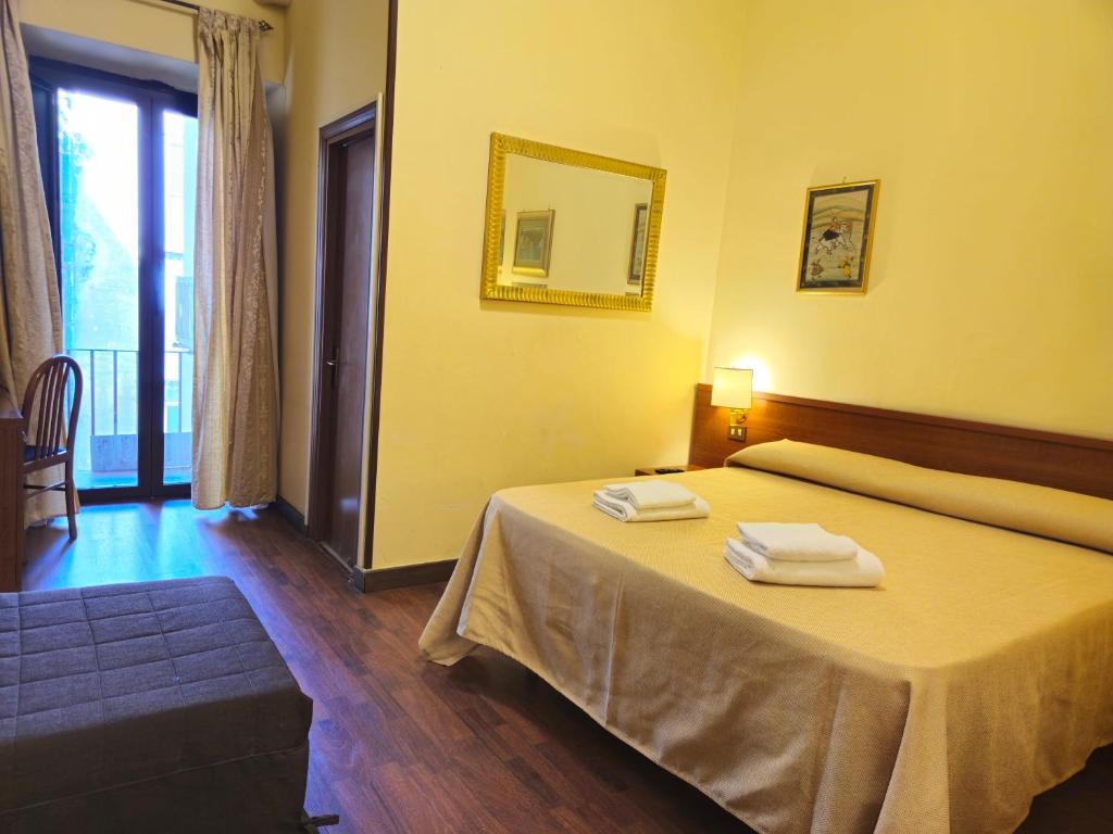 Postel nebo postele na pokoji v ubytování Hotel Azzurra