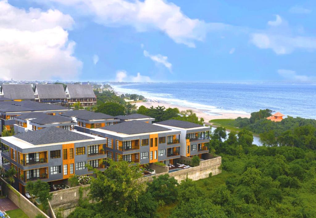 an aerial view of a resort and the beach at Secana Beachtown Resort & Residences in Canggu