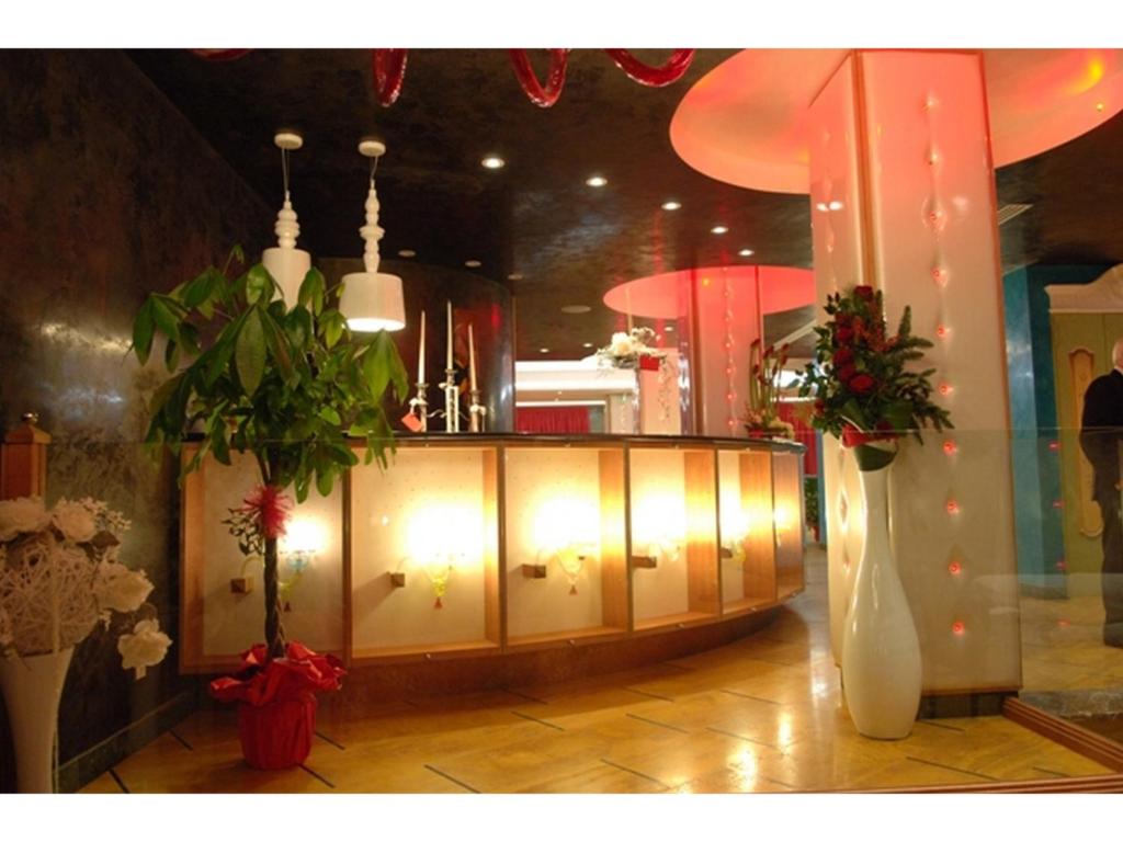 a room with a counter with lights in a store at Hotel La Rosa dei Venti in Monte San Giusto