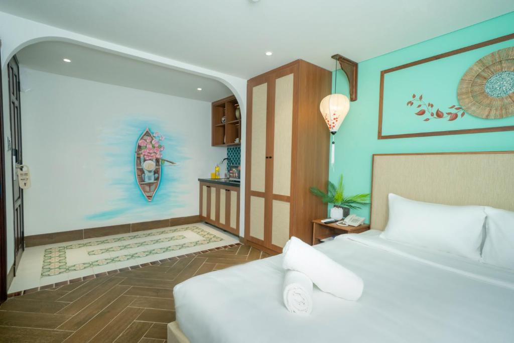 Giường trong phòng chung tại Sujet Hotel Da Nang