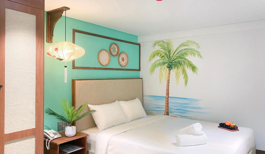 Postel nebo postele na pokoji v ubytování Sujet Hotel Da Nang