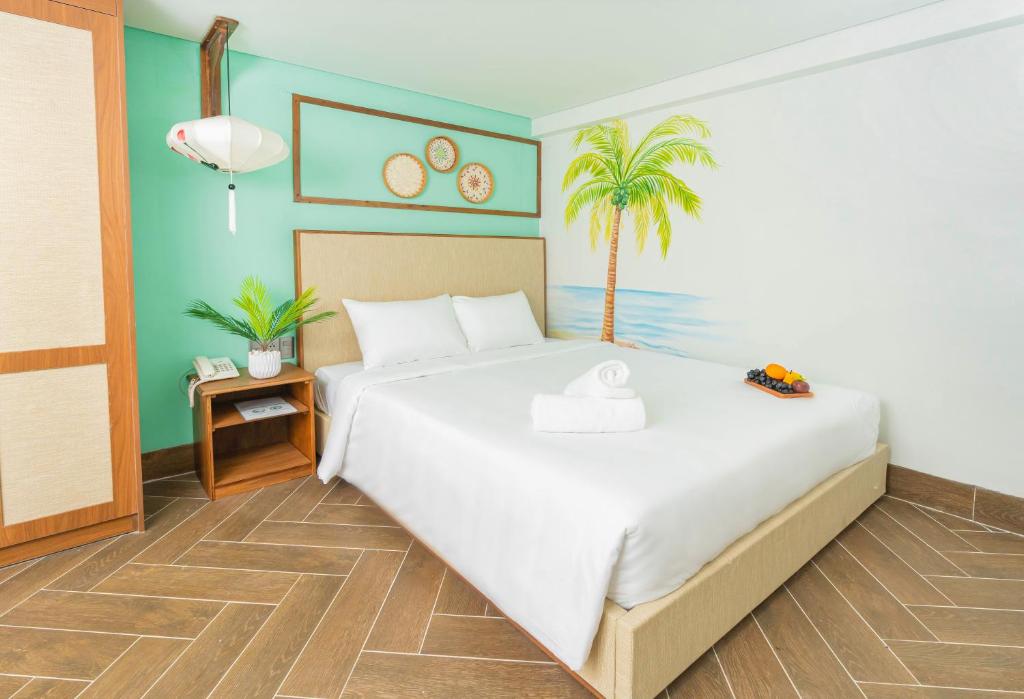 Postel nebo postele na pokoji v ubytování Sujet Hotel Da Nang