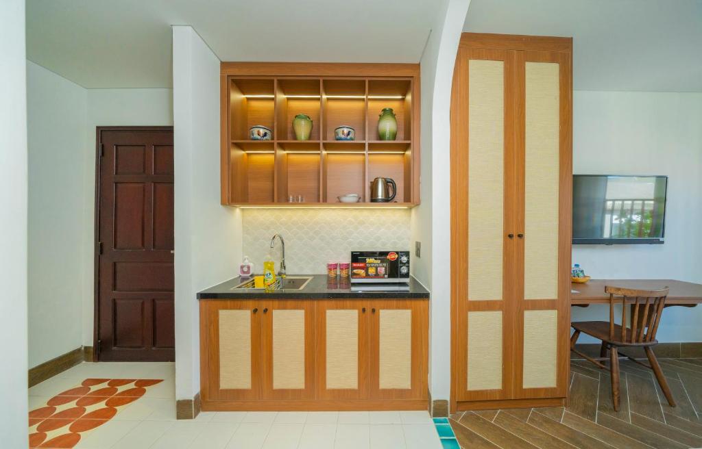 Kuchyň nebo kuchyňský kout v ubytování Sujet Hotel Da Nang