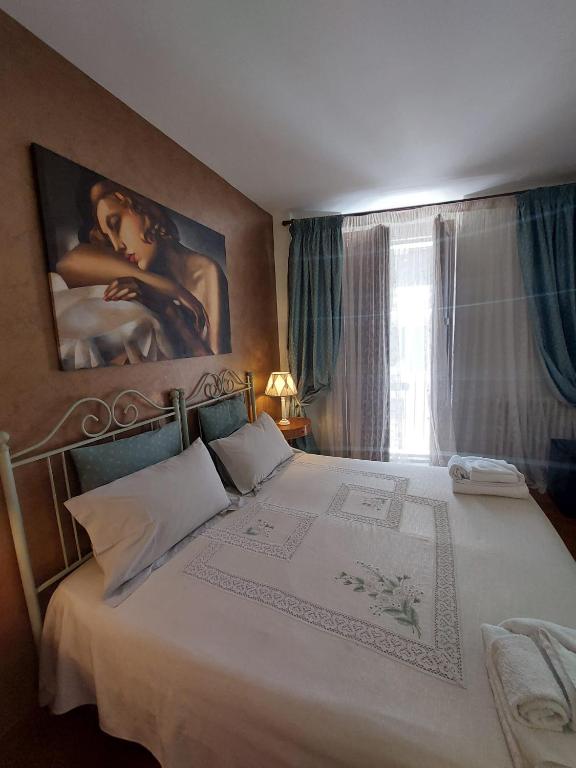 A bed or beds in a room at B&B Il Grifone