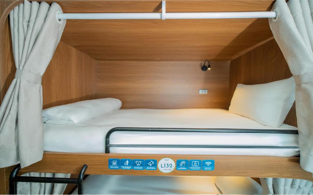 Giường trong phòng chung tại Sujet Hotel Da Nang