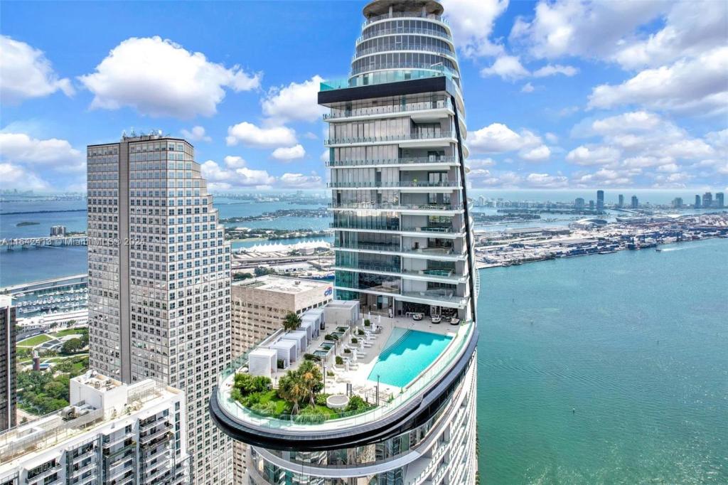 an aerial view of a tall building with a pool at ASTON MARTIN TOWER Miami in Miami
