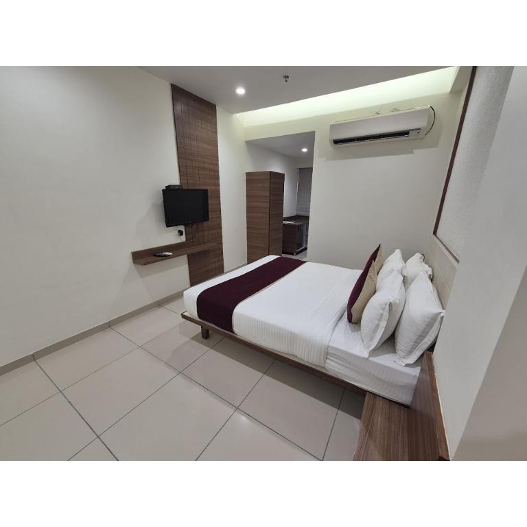Postel nebo postele na pokoji v ubytování Hotel Ashray Inn Express