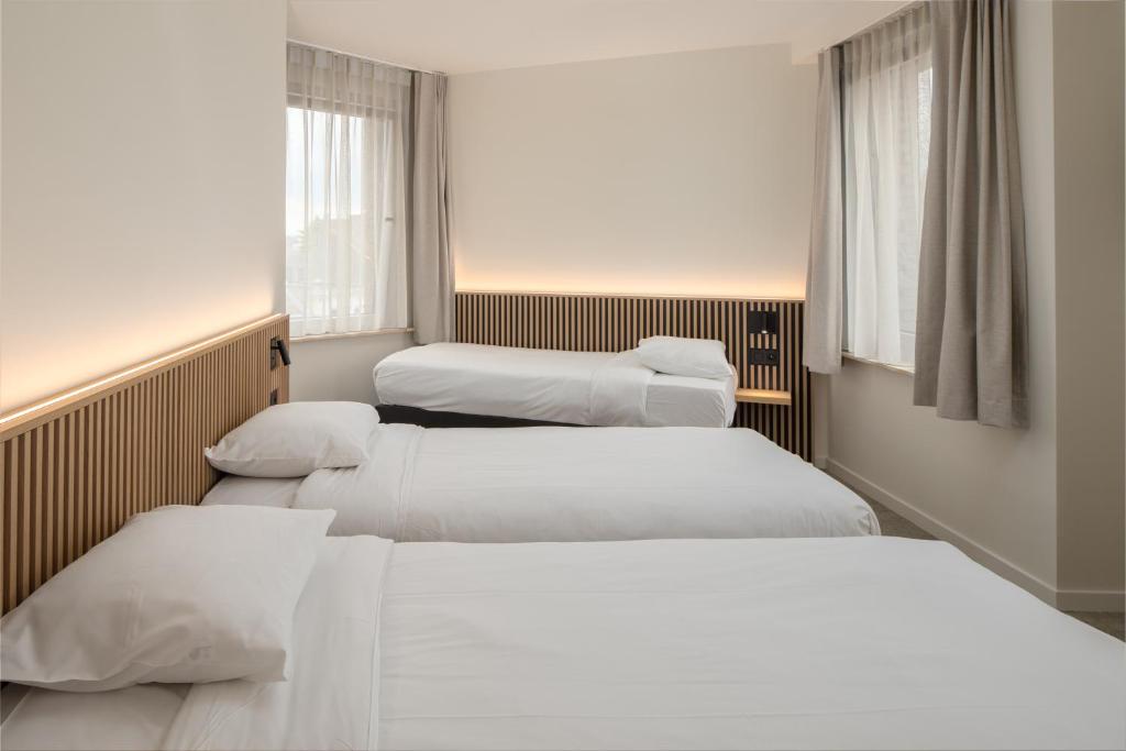 Postel nebo postele na pokoji v ubytování Hotel Chamade