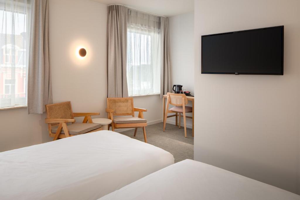 TV a/nebo společenská místnost v ubytování Hotel Chamade