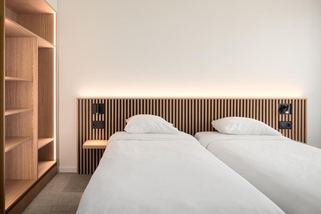 Postel nebo postele na pokoji v ubytování Hotel Chamade