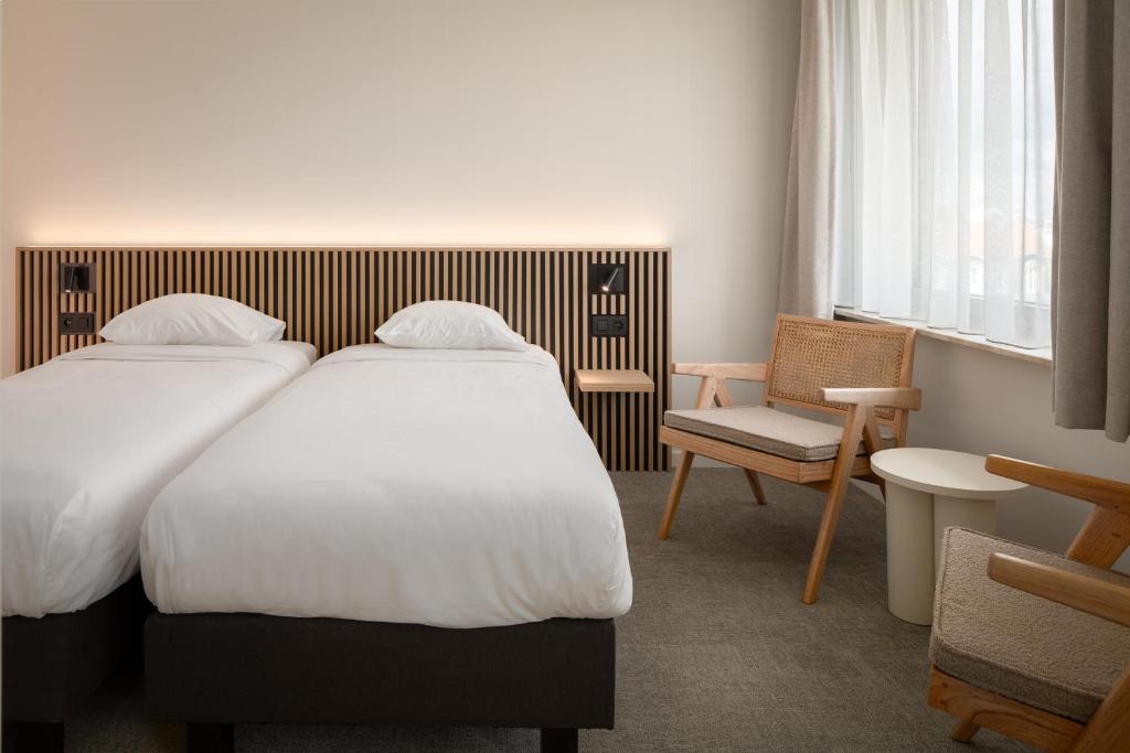 Postel nebo postele na pokoji v ubytování Hotel Chamade
