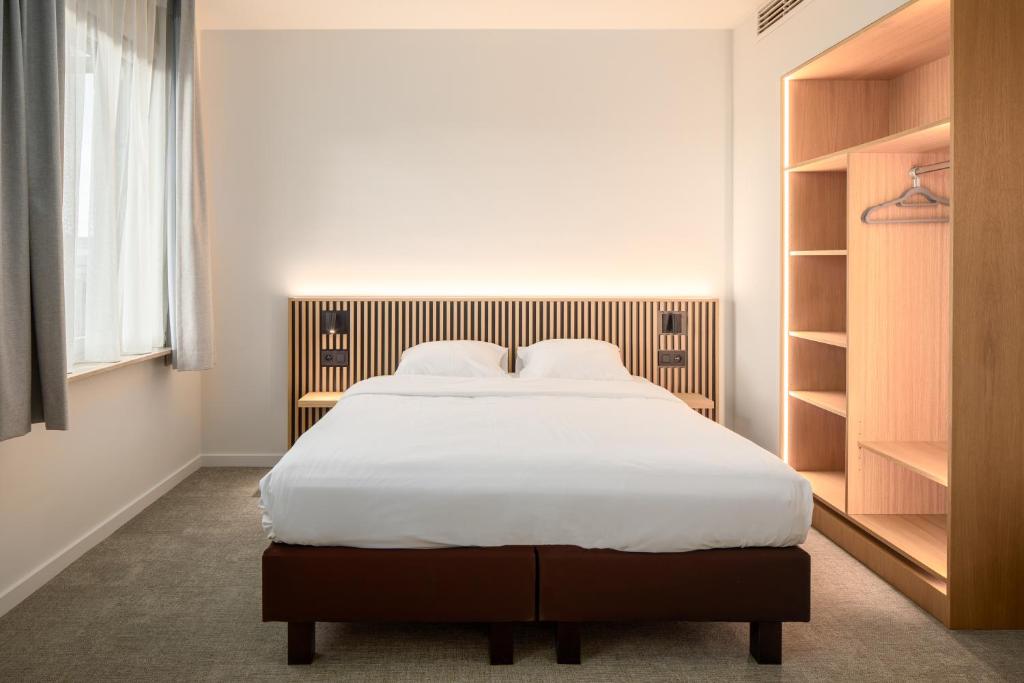 Postel nebo postele na pokoji v ubytování Hotel Chamade