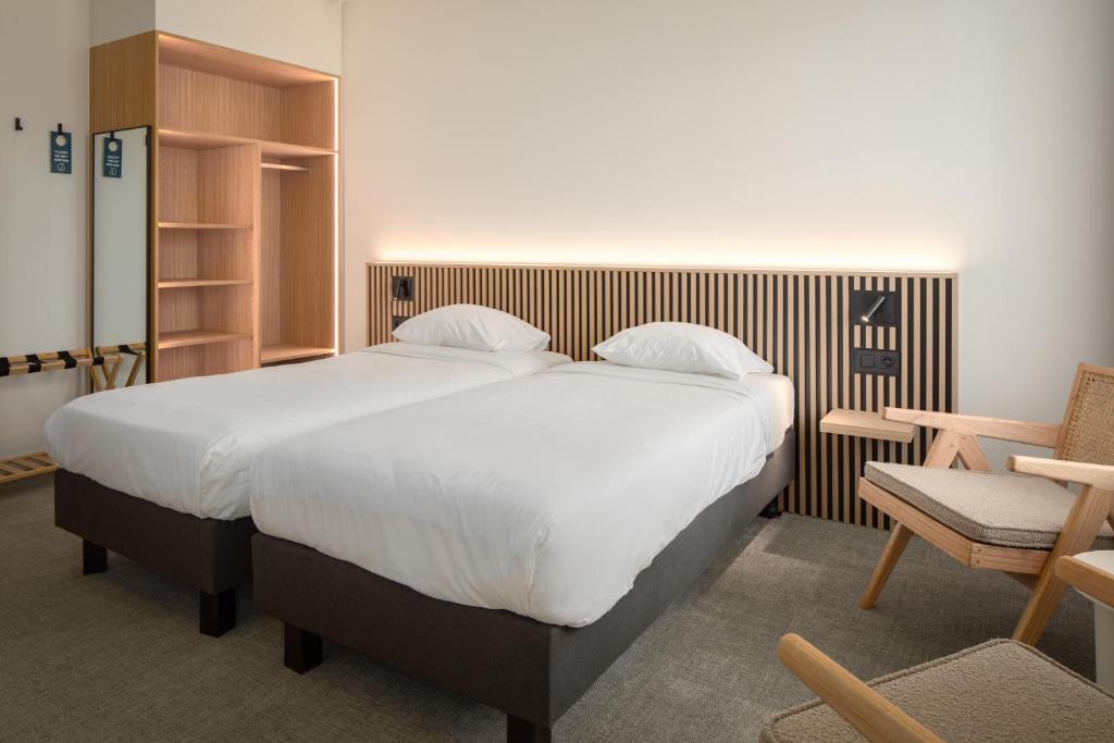 Postel nebo postele na pokoji v ubytování Hotel Chamade