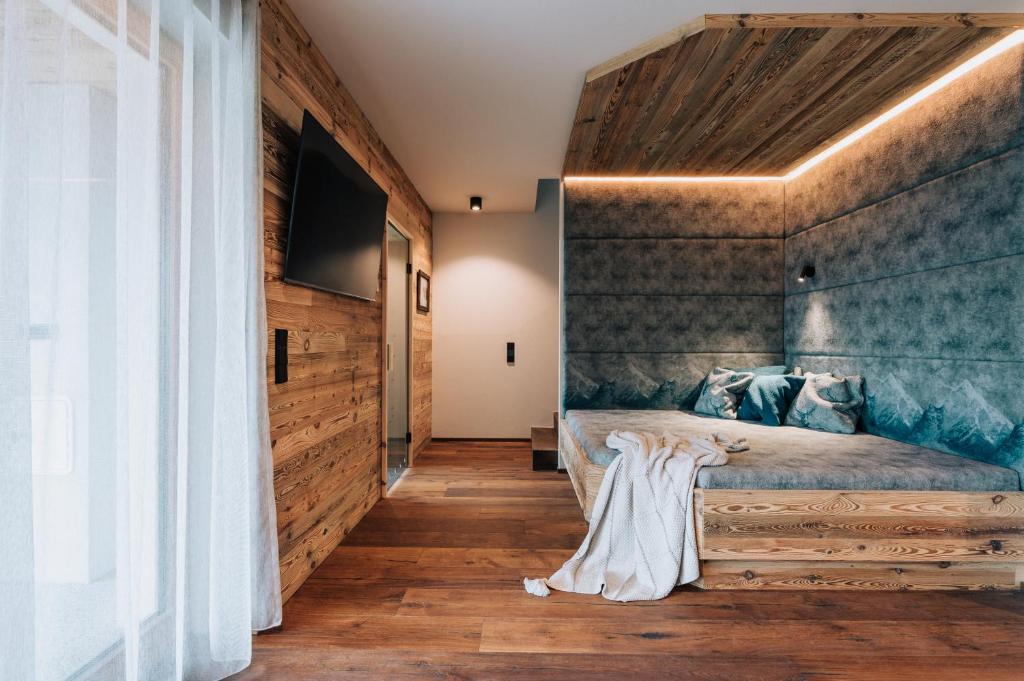 Postel nebo postele na pokoji v ubytování Almchalet - Luxus am Fuße der Koralpe