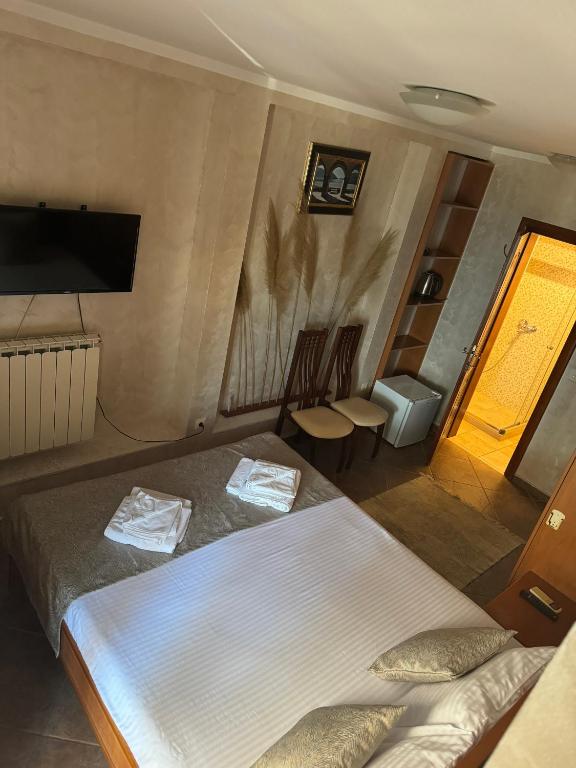 Postel nebo postele na pokoji v ubytování Hotel Anderba