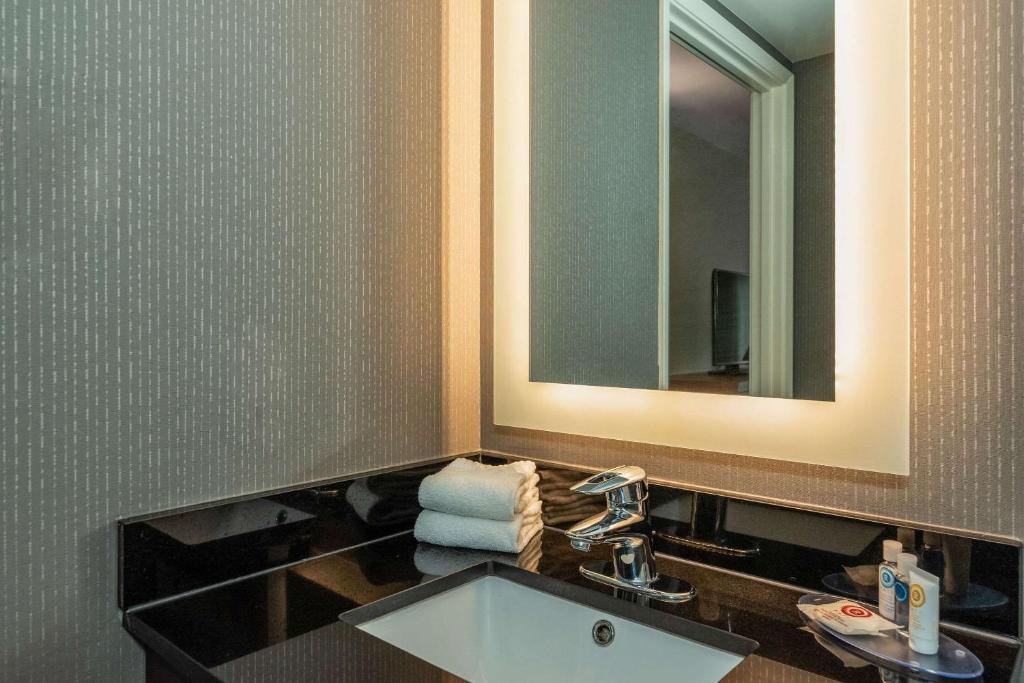 a bathroom with a sink and a mirror at Comfort Inn in Charlottetown