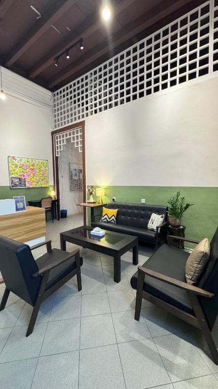 Area soggiorno di Swing & Pillows - 75 Chulia St, Georgetown Penang