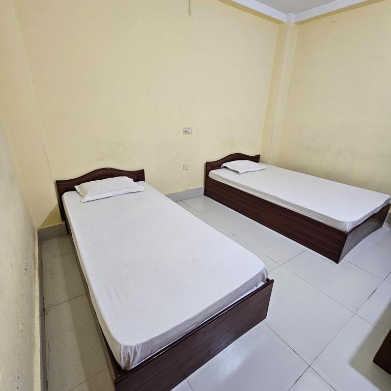 Postel nebo postele na pokoji v ubytování Mahendra Hotel