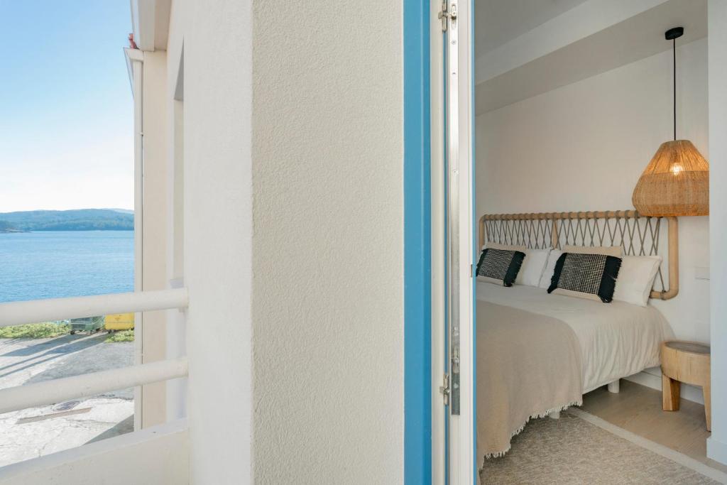A bed or beds in a room at O mar de preciosa
