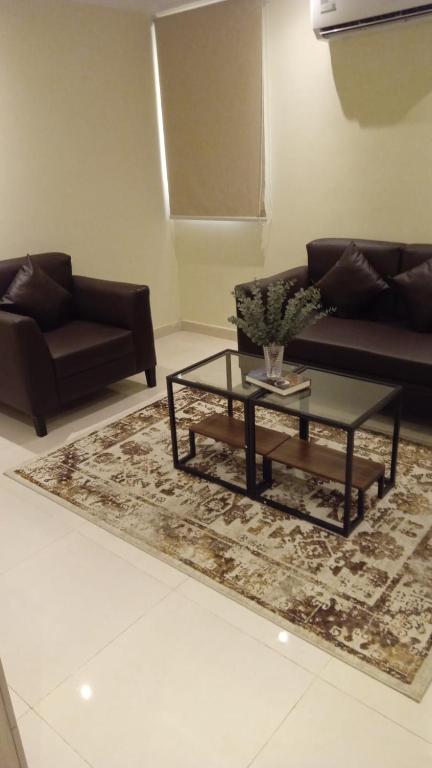 Posezení v ubytování Al tawfeeg hotel - Al Azizyah