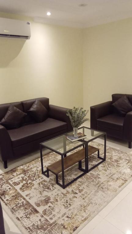 Posezení v ubytování Al tawfeeg hotel - Al Azizyah