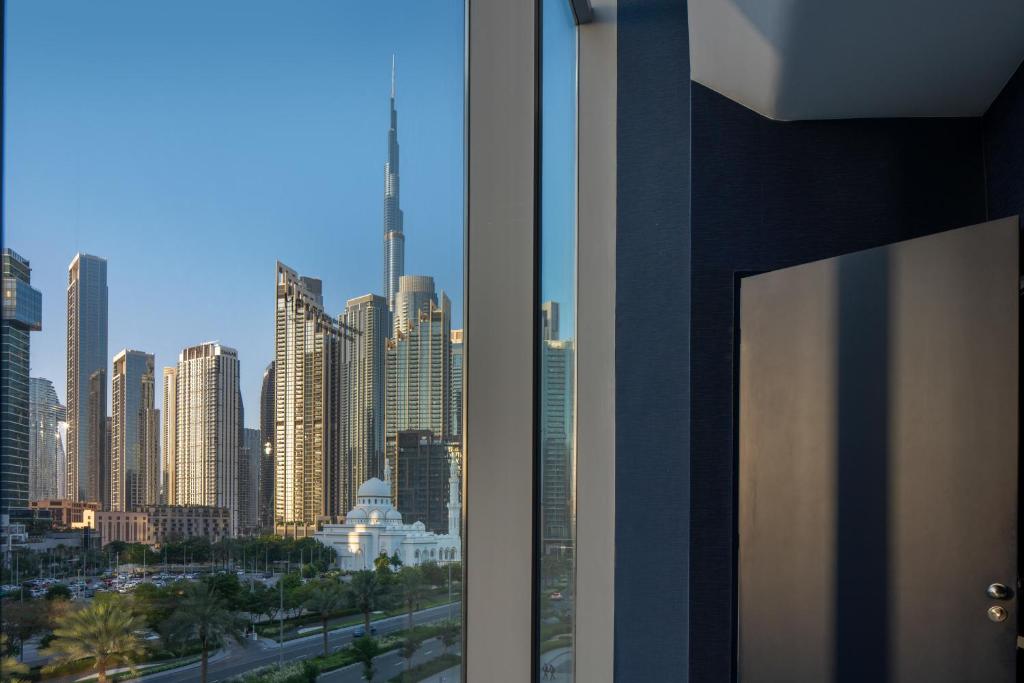 Nespecifikovaný výhled na destinaci Dubaj nebo výhled na město při pohledu z aparthotelu