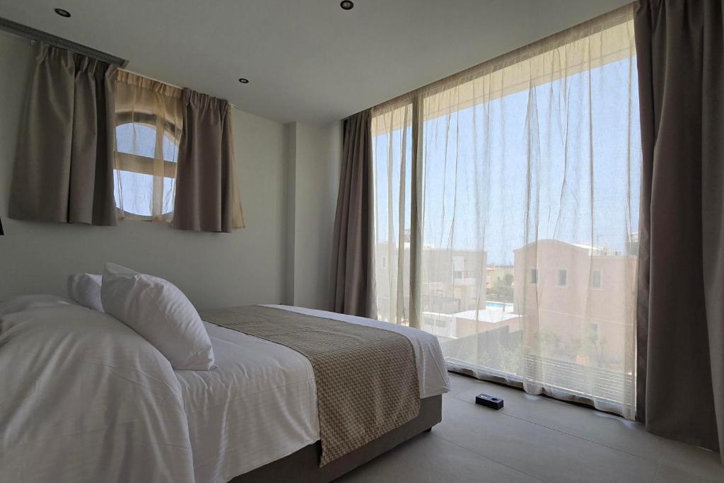 Postel nebo postele na pokoji v ubytování Trapezia Luxury Living