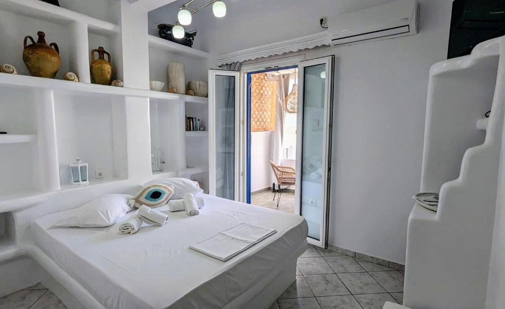 Postel nebo postele na pokoji v ubytování Anoi Rooms