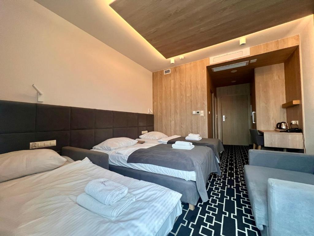 Postel nebo postele na pokoji v ubytování Hotel Wena