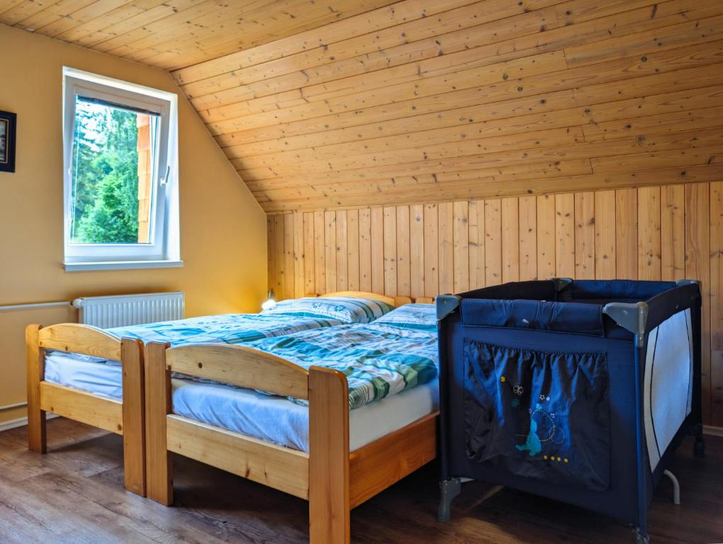 Postel nebo postele na pokoji v ubytování Desný Kout