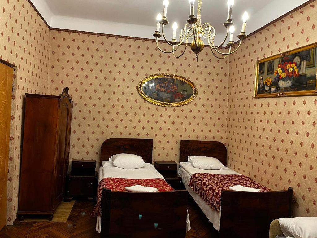 Posteľ alebo postele v izbe v ubytovaní Metropolitan Apartments