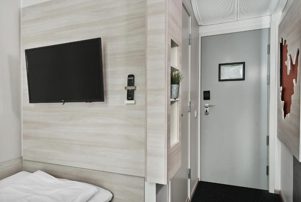 TV a/nebo společenská místnost v ubytování Smarthotel Oslo