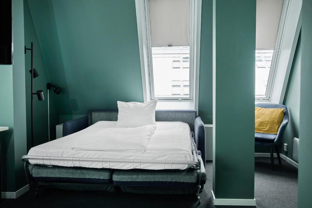 Postel nebo postele na pokoji v ubytování Smarthotel Oslo