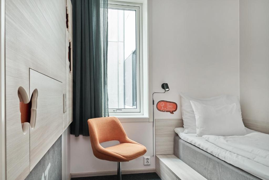 Postel nebo postele na pokoji v ubytování Smarthotel Oslo