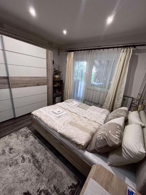 A bed or beds in a room at Cseppecske Apartman