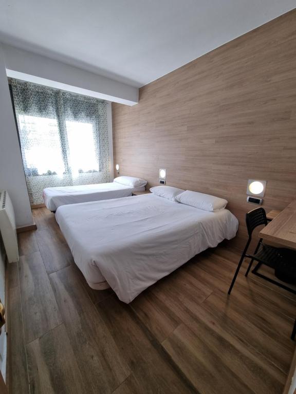 Postel nebo postele na pokoji v ubytování Hotel Avanti