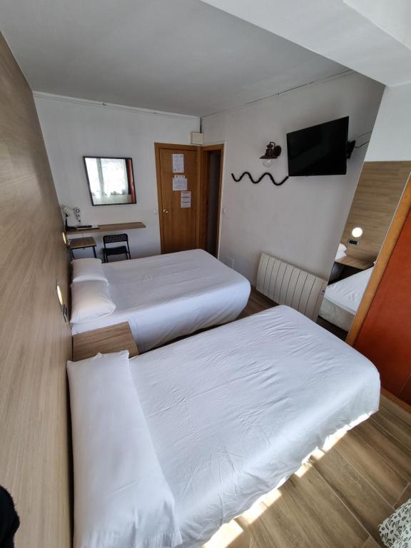 Postel nebo postele na pokoji v ubytování Hotel Avanti