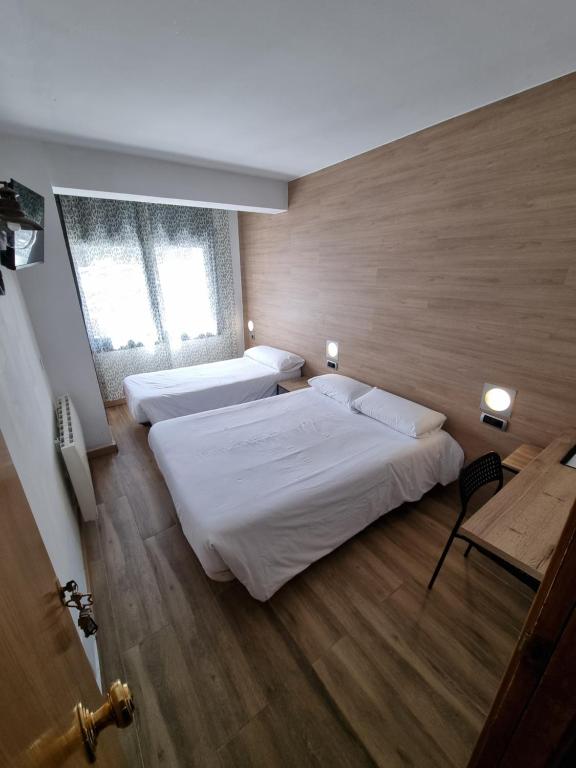 Postel nebo postele na pokoji v ubytování Hotel Avanti