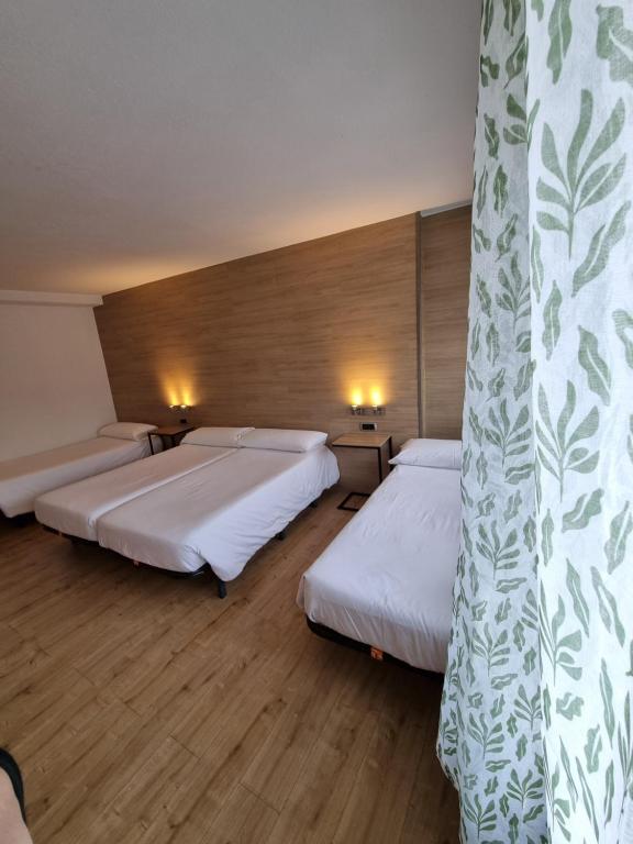 Postel nebo postele na pokoji v ubytování Hotel Avanti