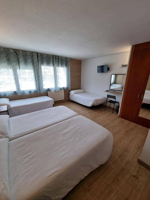 Postel nebo postele na pokoji v ubytování Hotel Avanti