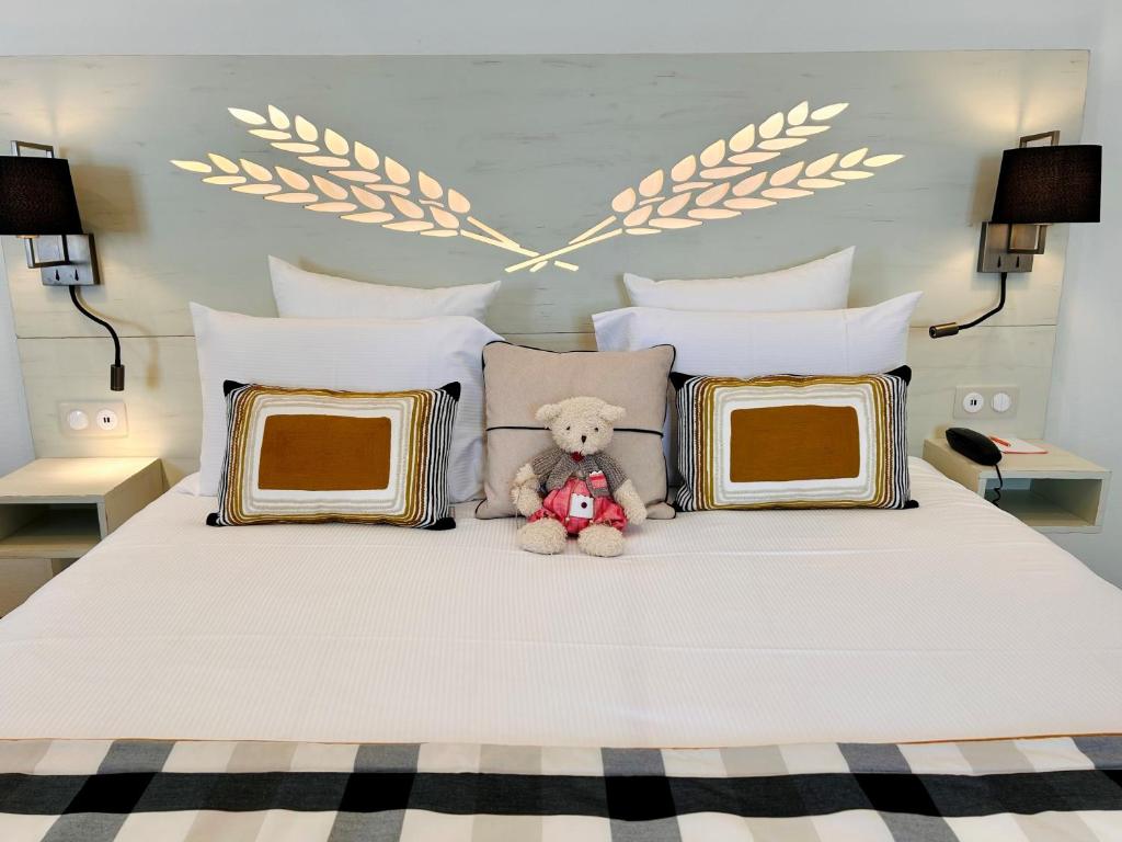 Postel nebo postele na pokoji v ubytování Hotel Beaucour