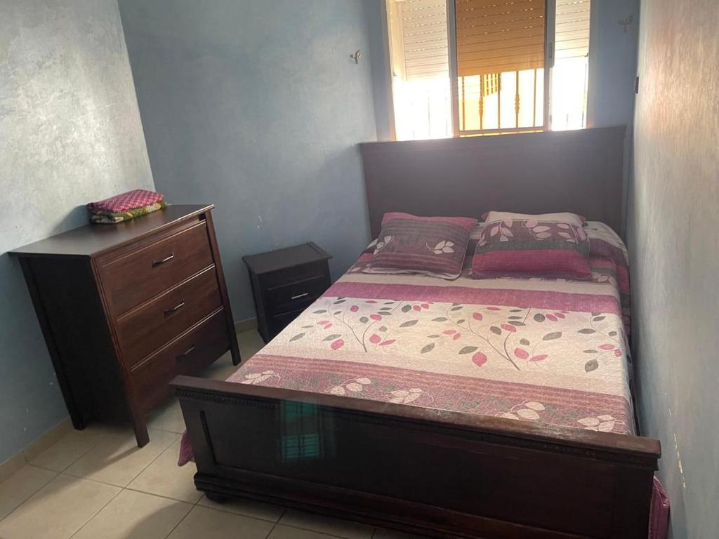 a small bedroom with a bed and a dresser at Très belle Appart à louer pour vos vacances-Dyafa Agadir- A 2chambres in Agadir