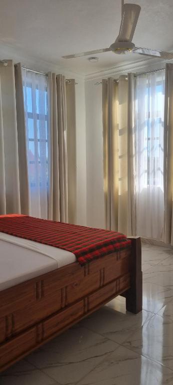 Postel nebo postele na pokoji v ubytování Terry's Villa Nungwi